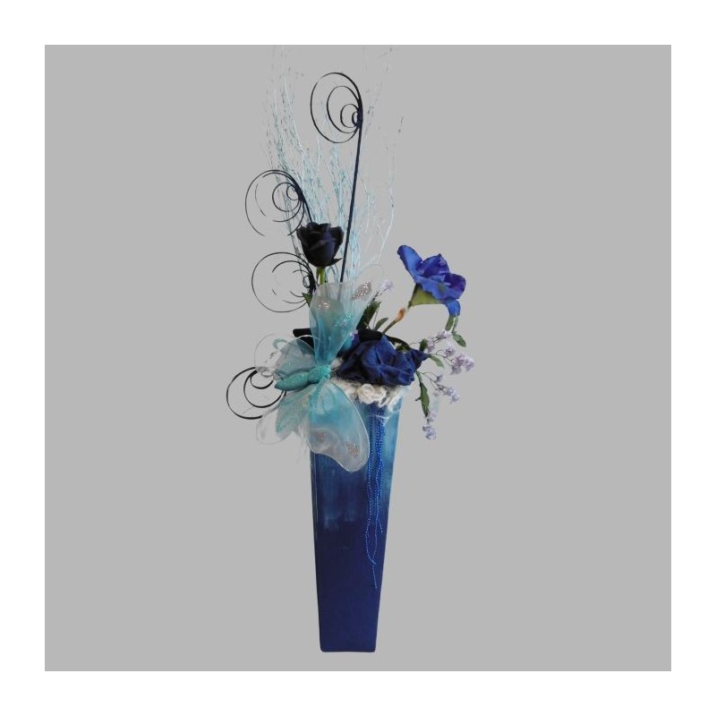 Flower arrangement blue vase and butterfly