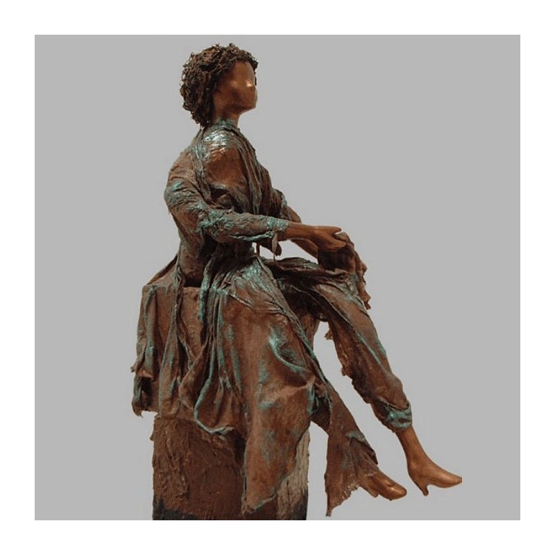 sitting doll of paverpol on pedestal