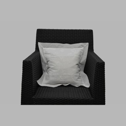Cushion cover with white leaf design