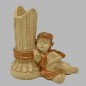 classic chandelier with tiny angel seated right