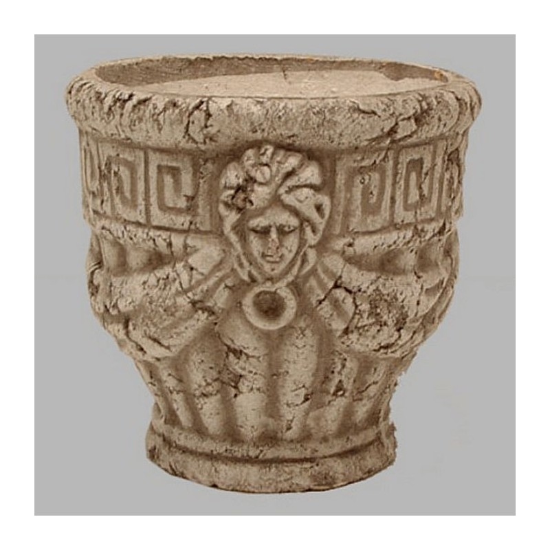 pot de fleurs en pierre avec des têtes de modification