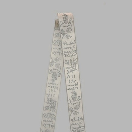 Decoration ribbon of fabric white grey flowers and text pattern width 40 mm