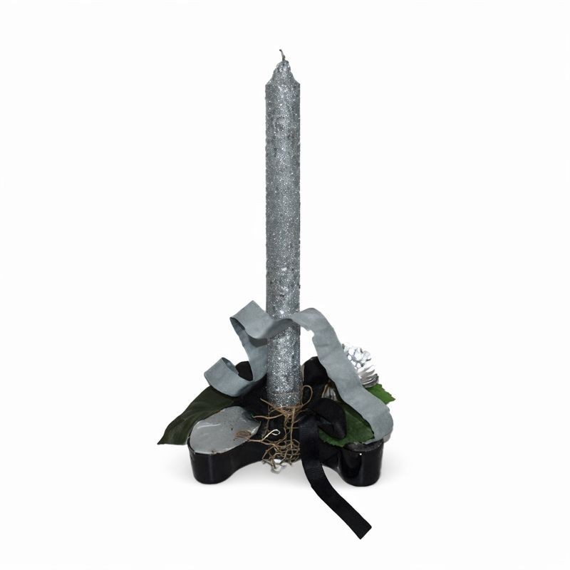 Silver candle in ceramic floral arrangement – decorative object