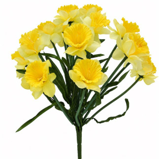 Bouquet of yellow artificial daffodils with green leaves and stems on a white background.