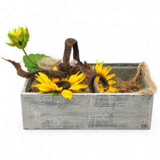 Yellow artificial sunflowers with a tall flower bud, curved brown branch, flax and jute in a wooden box