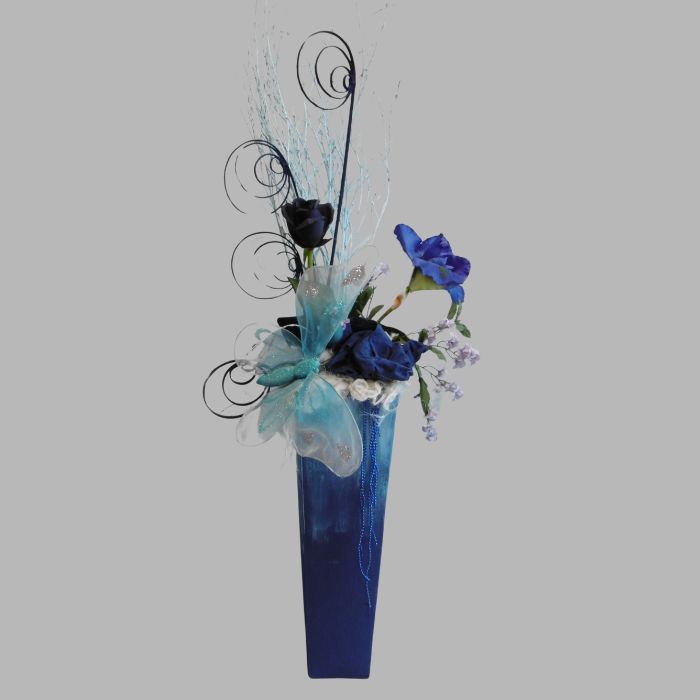 Flower arrangement blue vase and butterfly