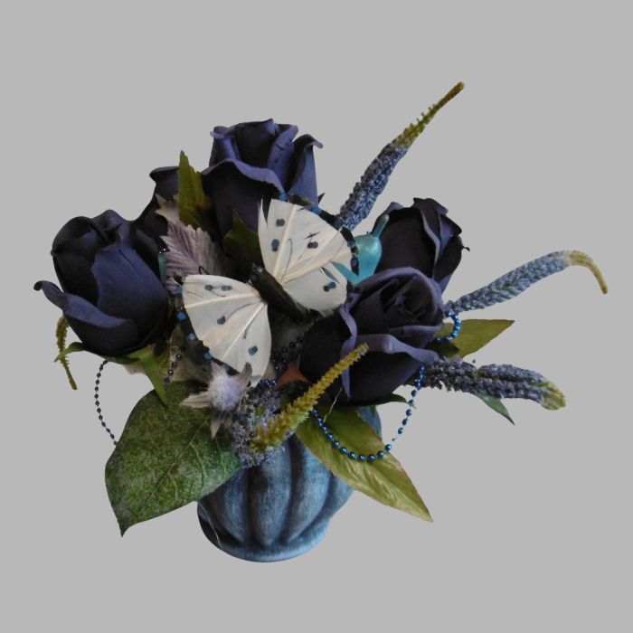 flower arrangement biedermeier blue in pot with butterfly