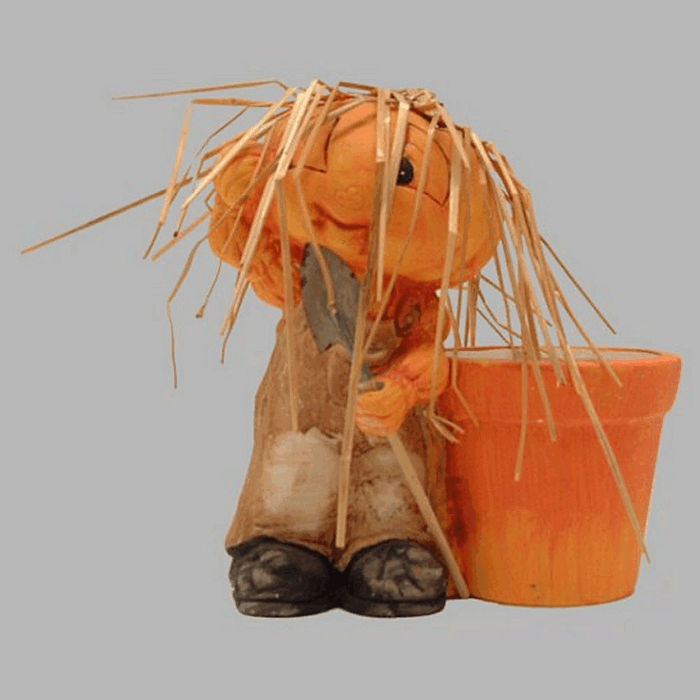 Pot de fleurs avec homme citrouille de céramique