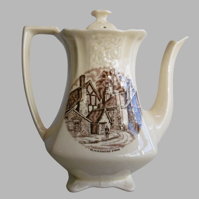 Vintage Teapot with Blacksmith's Forge Scene - Classic Ceramic Art